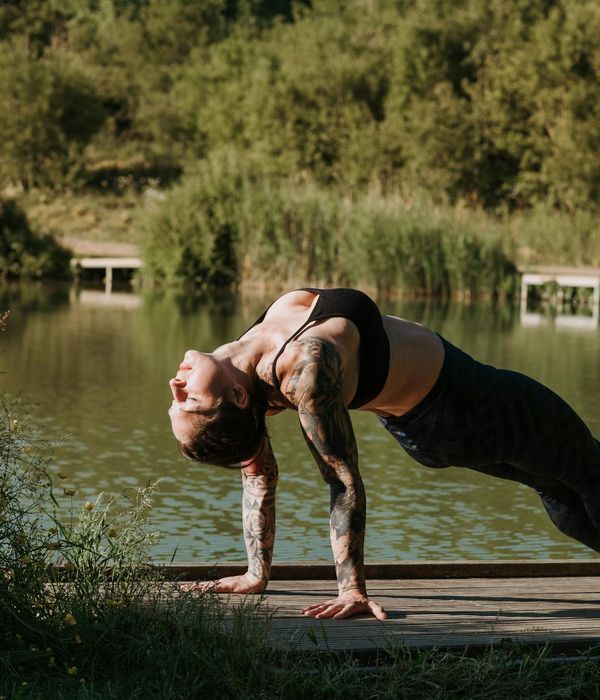 Woman in an upward-facing yoga pose, full of energy.